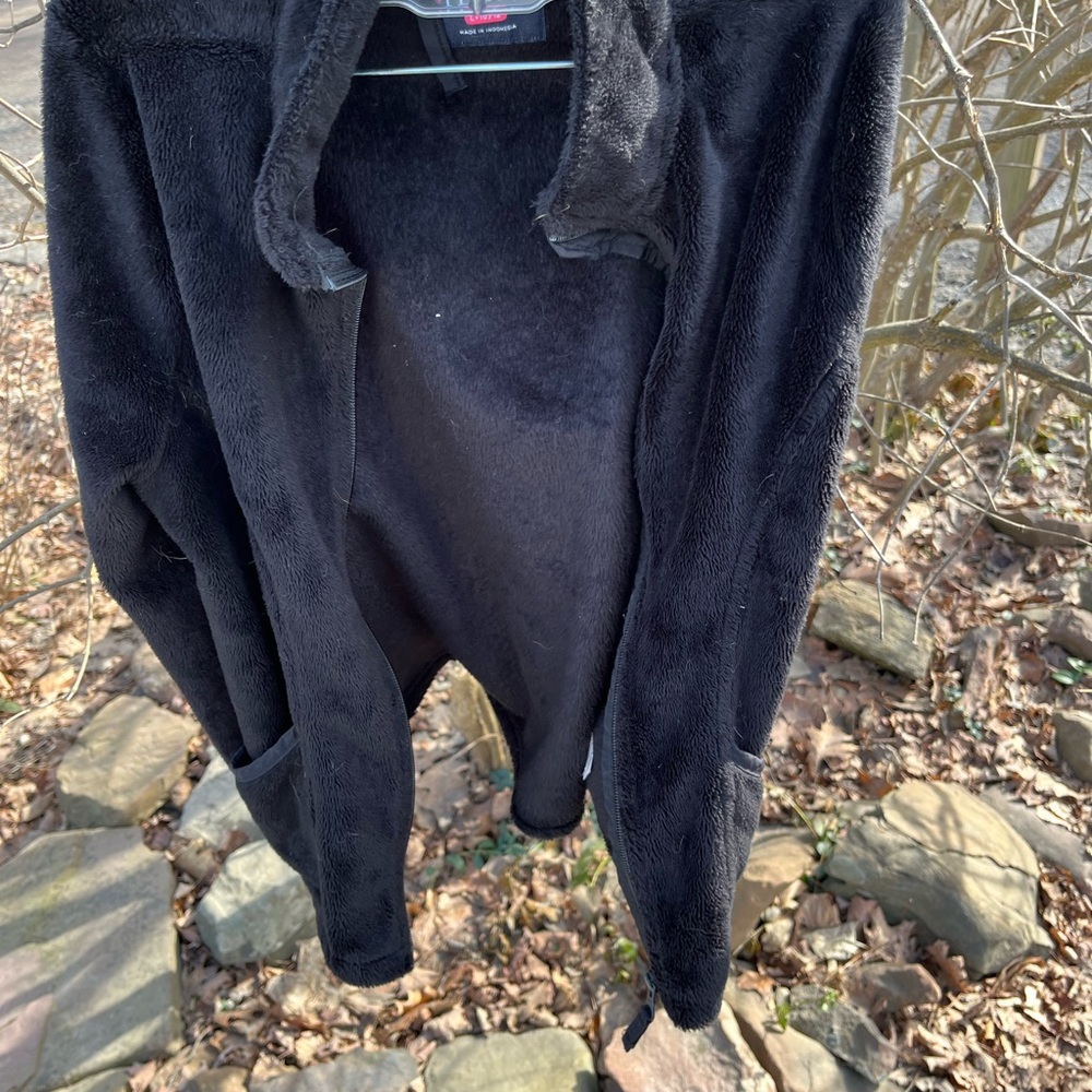 Place black fur coat